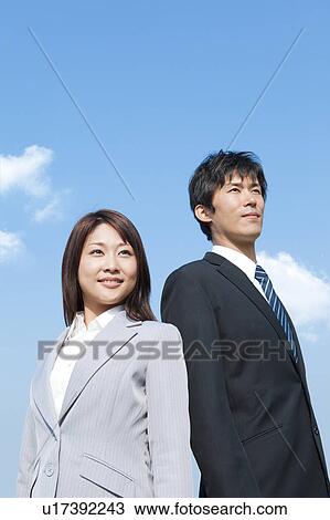 Stock Image - Business people standing. Fotosearch