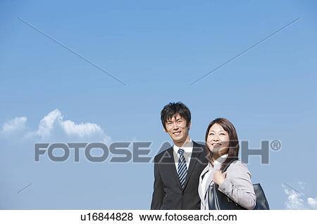 Stock Photo - Business people standing. Fotosearch
