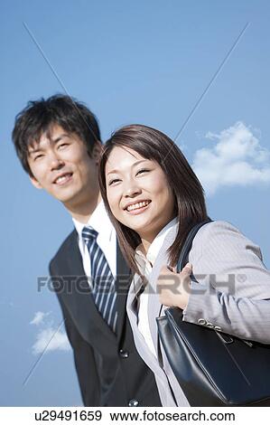 Stock Photo - Business people standing. Fotosearch
