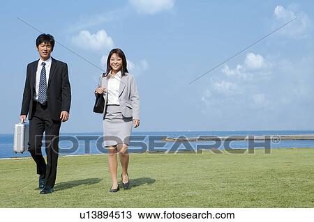Stock Image - Business people walking. Fotosearch