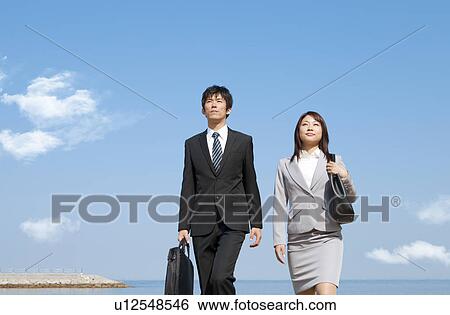 Stock Photograph - Business people walking. Fotosearch