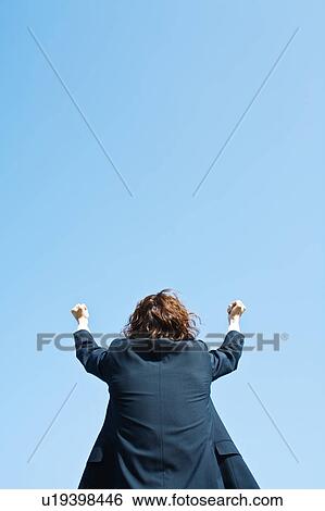 Businessman Celebrating Against Blue Sky View Large Photo Image Stock Photograph - Businessman Celebrating Against Blue Sky. Fotosearch
