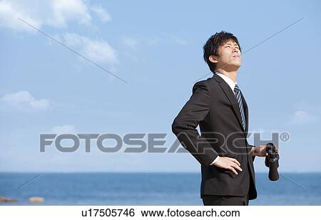 Businessman holding binoculars View Large Photo Image Stock Photograph - Businessman holding binoculars. Fotosearch