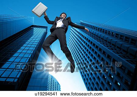 Businessman jumping in the air View Large Photo Image Stock Image - Businessman jumping in the air. Fotosearch