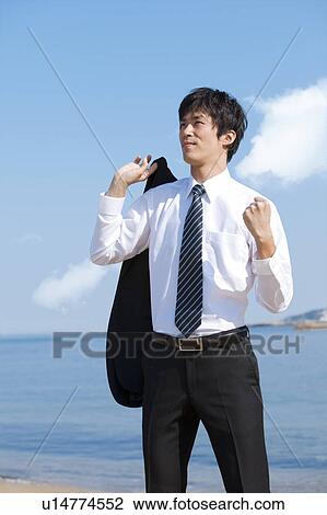 Stock Image - Businessman making a fist. Fotosearch
