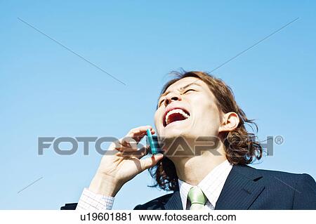 Stock Image - Businessman On Mobile Phone. Fotosearch