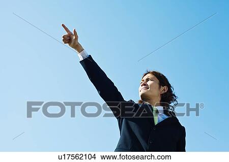 Businessman Pointing at Sky View Large Photo Image Picture - Businessman Pointing at Sky. Fotosearch