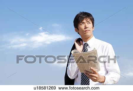 Businessman reading newspaper View Large Photo Image Stock Photo - Businessman reading newspaper. Fotosearch