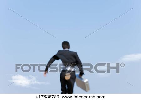 Businessman running, rear view View Large Photo Image Stock Photo - Businessman running, rear view. Fotosearch
