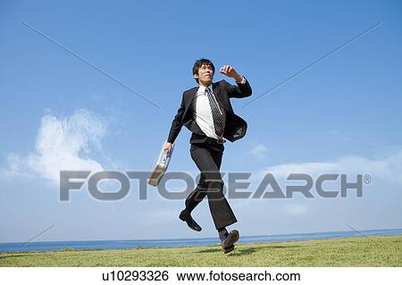 Stock Photograph - Businessman running. Fotosearch