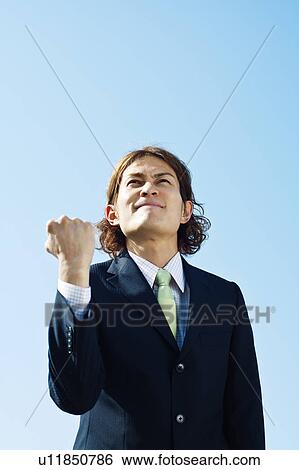 Stock Photograph - Businessman Shaking Fists. Fotosearch