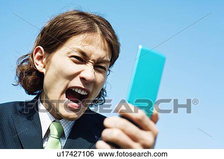 Businessman Shouting to Mobile Phone View Large Photo Image Stock Photograph - Businessman Shouting to Mobile Phone. Fotosearch