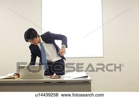 Businessman using laptop View Large Photo Image Stock Photo - Businessman using laptop. Fotosearch