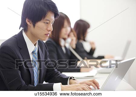 Stock Photograph - Businessman using laptop. Fotosearch