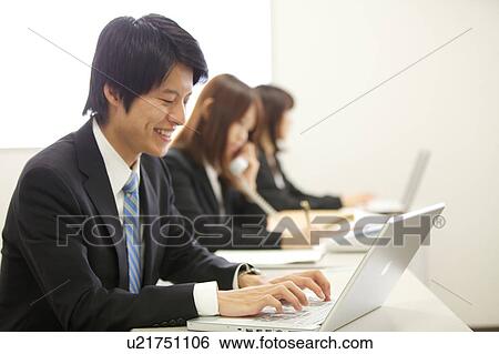 Stock Photograph - Businessman using laptop. Fotosearch