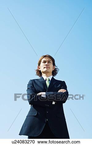 Stock Image - Businessman with Arms Crossed. Fotosearch