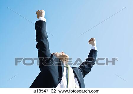 Businessman with Hands Raised View Large Photo Image Stock Image - Businessman with Hands Raised. Fotosearch