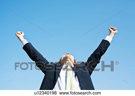 Stock Photo - Businessman with Hands Raised. Fotosearch