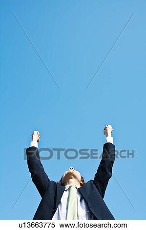Businessman with Hands Raised View Large Photo Image Stock Photography - Businessman with Hands Raised. Fotosearch