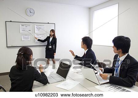 Businesspeople in a meeting View Large Photo Image Stock Image - Businesspeople in a meeting. Fotosearch