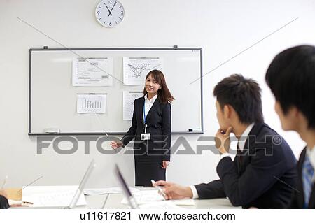 Businesspeople in a meeting View Large Photo Image Stock Image - Businesspeople in a meeting. Fotosearch