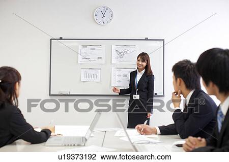 Businesspeople in a meeting View Large Photo Image Stock Image - Businesspeople in a meeting. Fotosearch