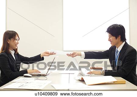 Businesspeople in a meeting View Large Photo Image Stock Photo - Businesspeople in a meeting. Fotosearch