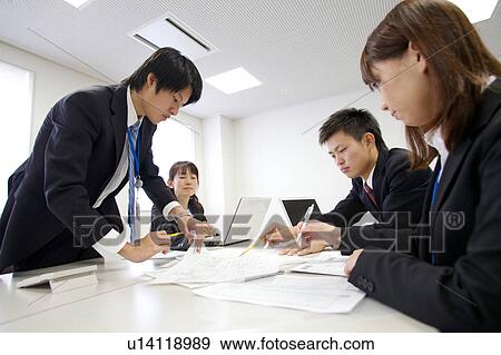 Stock Photo - Businesspeople in a meeting. Fotosearch