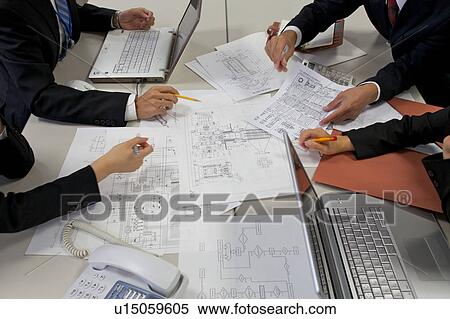 Businesspeople in a meeting View Large Photo Image Stock Photography - Businesspeople in a meeting. Fotosearch