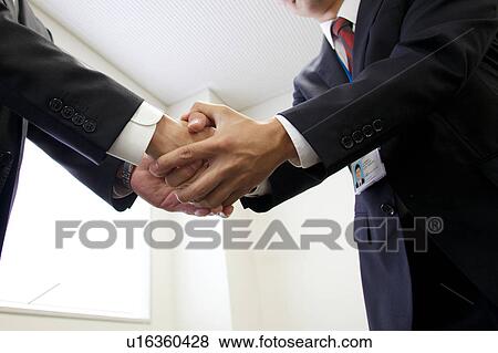 Businesspeople shaking hands View Large Photo Image Stock Photo - Businesspeople shaking hands. Fotosearch