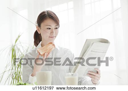 Stock Photo - Businesswoman Having Breakfast. Fotosearch