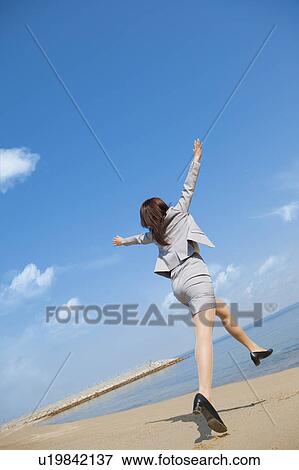 Businesswoman jumping View Large Photo Image Stock Photo - Businesswoman jumping. Fotosearch