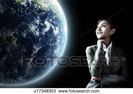 Stock Image - Businesswoman Looking at The Earth. Fotosearch