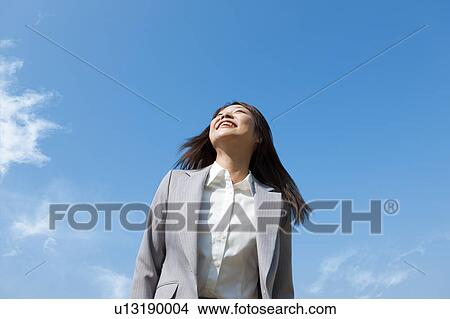 Businesswoman looking up View Large Photo Image Picture - Businesswoman looking up. Fotosearch