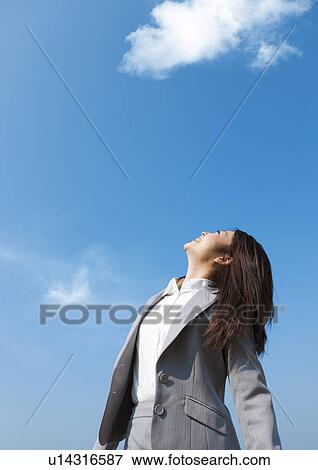 Businesswoman looking up View Large Photo Image Stock Photo - Businesswoman looking up. Fotosearch