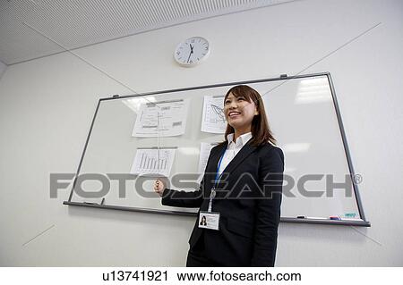 Businesswoman making a presentation View Large Photo Image Stock Image - Businesswoman making a presentation. Fotosearch