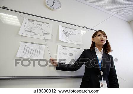 Businesswoman making a presentation View Large Photo Image Stock Image - Businesswoman making a presentation. Fotosearch