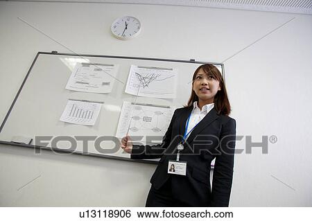 Stock Photograph - Businesswoman making a presentation. Fotosearch