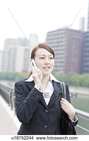 Businesswoman on Phone View Large Photo Image Picture - Businesswoman on Phone. Fotosearch