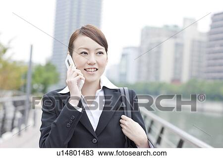 Stock Image - Businesswoman on Phone. Fotosearch