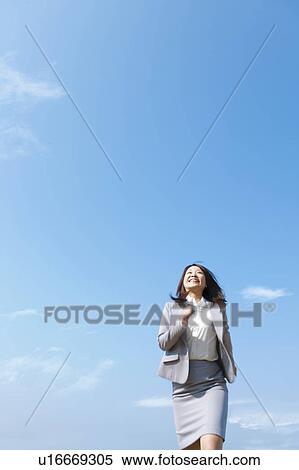 Stock Photography - Businesswoman running. Fotosearch