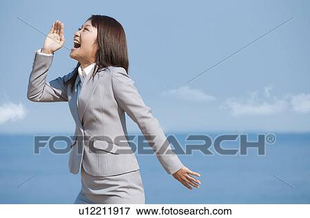 Stock Photo - Businesswoman shouting. Fotosearch