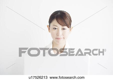 Stock Image - Businesswoman Using Laptop. Fotosearch