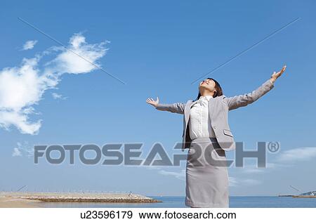 Businesswoman with arms raised View Large Photo Image Stock Photo - Businesswoman with arms raised. Fotosearch
