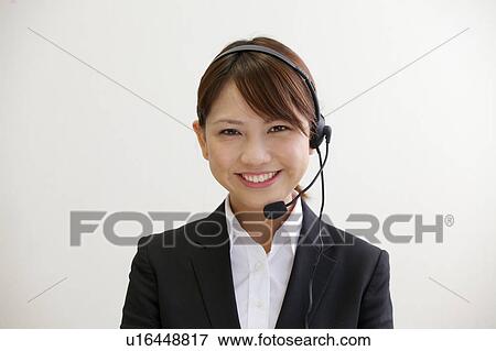 Businesswoman with headset View Large Photo Image Stock Photo - Businesswoman with headset. Fotosearch