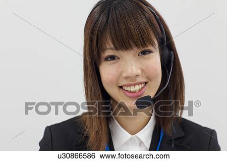 Businesswoman with headset View Large Photo Image Stock Photograph - Businesswoman with headset. Fotosearch
