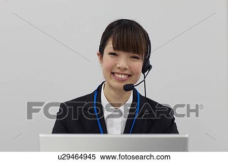 Stock Photography - Businesswoman with headset. Fotosearch