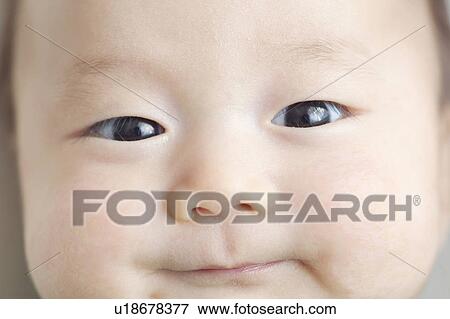 Stock Photo - Close-up of baby's face. Fotosearch