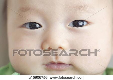Close-up of baby's face View Large Photo Image Stock Photograph - Close-up of baby's face. Fotosearch