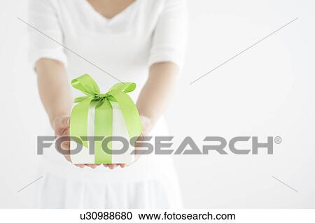 Close Up of Young Woman Holding Gift View Large Photo Image Stock Image - Close Up of Young Woman Holding Gift. Fotosearch